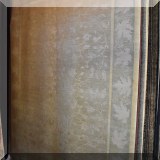 R15. Handcrafted rug with leaf border.